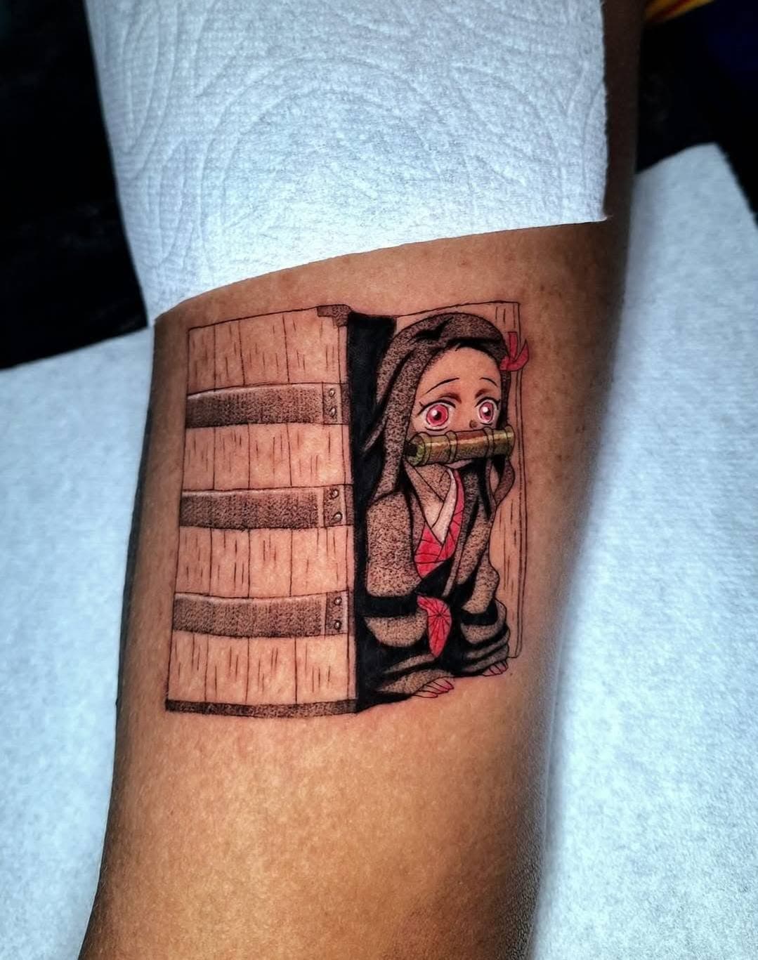 Anime blackwork tattoo — patterned coat and decisive sword stance
