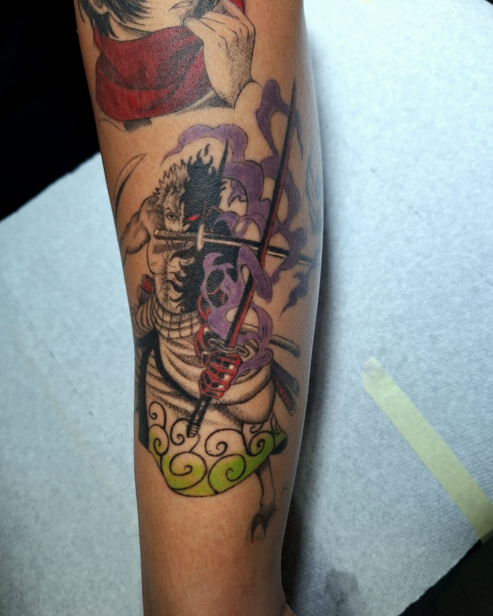 Healed fine-line anime tattoo