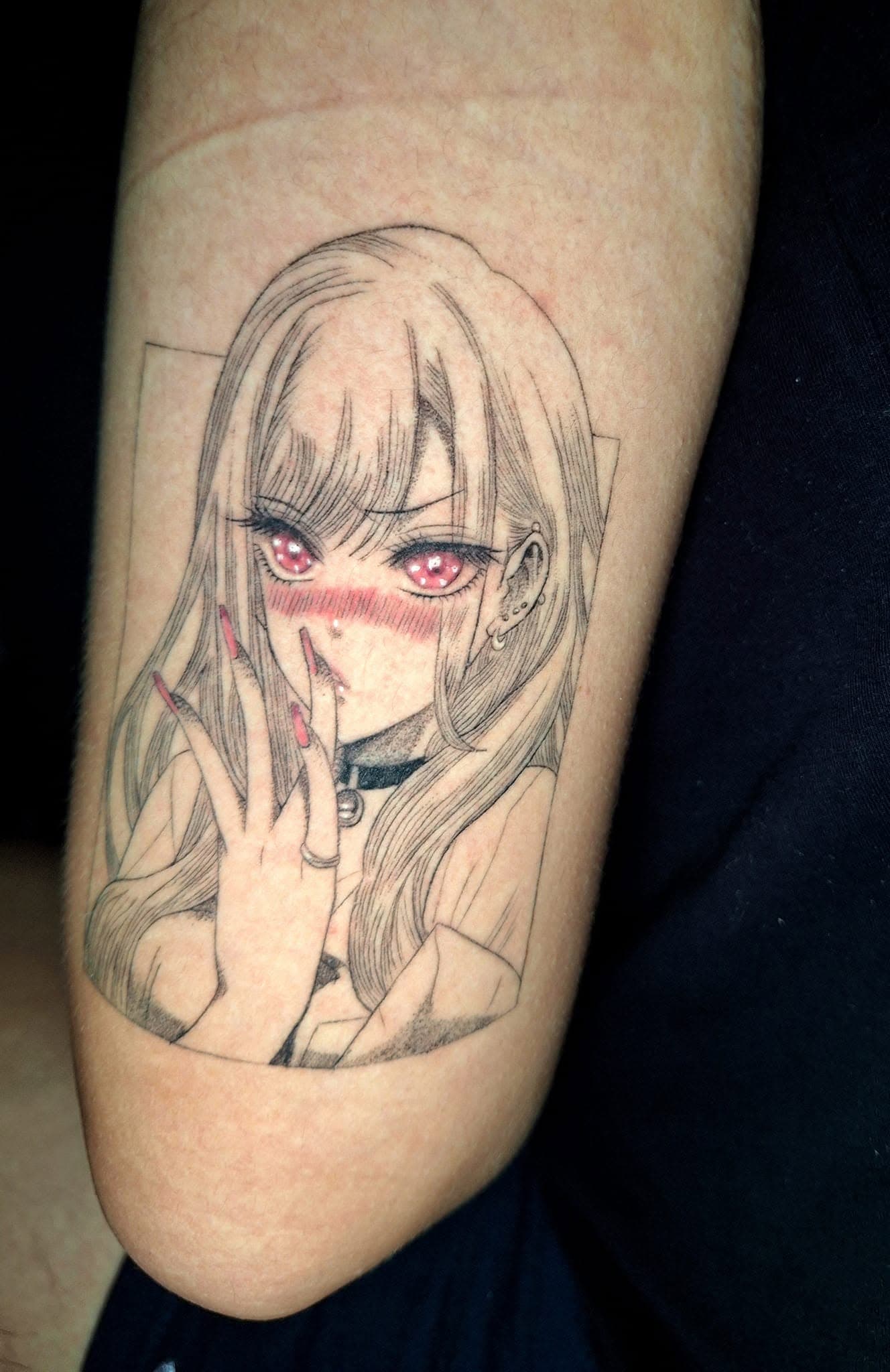 Fully healed anime-style blackwork tattoo