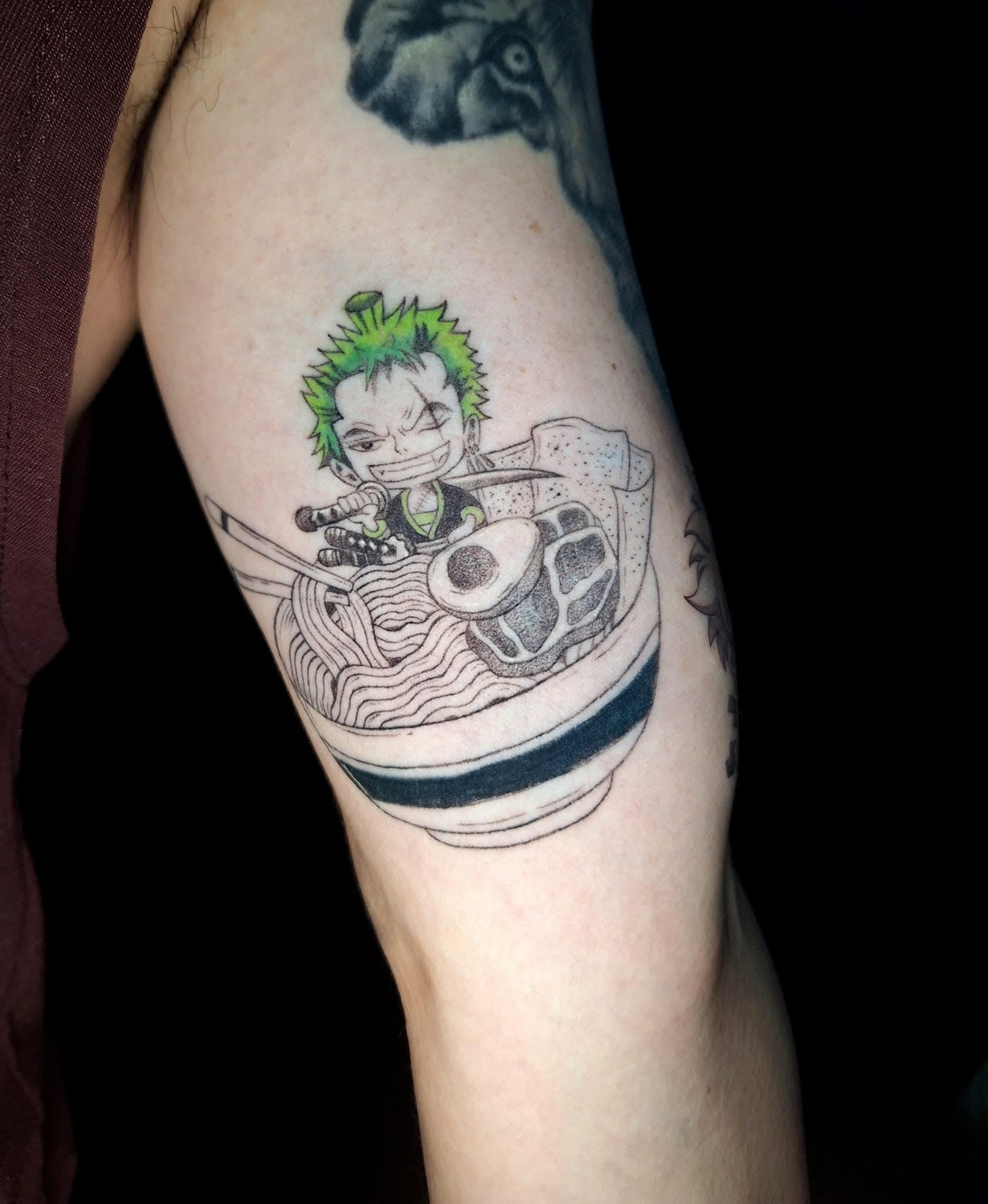 Fully healed fine-line anime tattoo