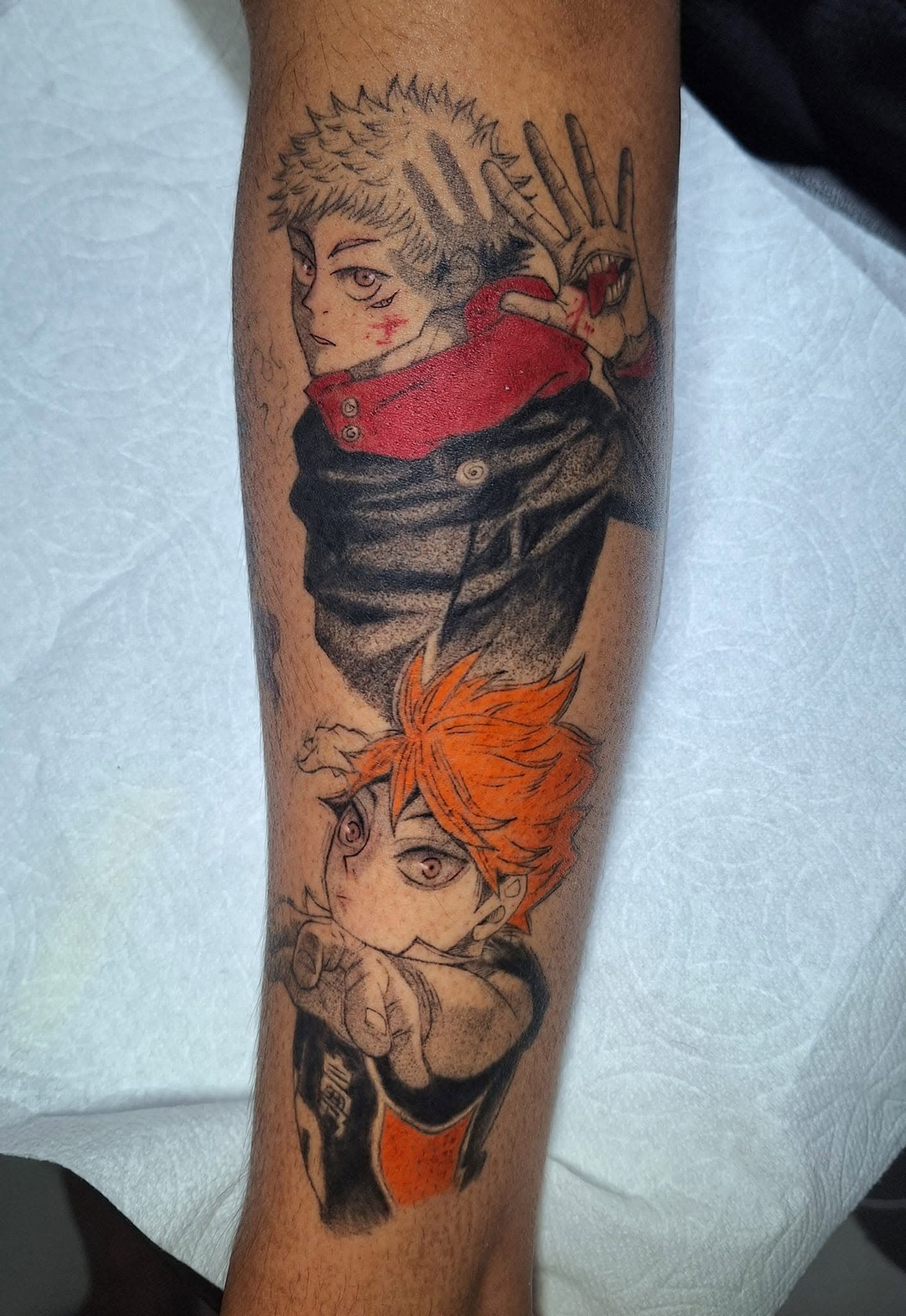 Healed anime tattoo — clean linework close-up