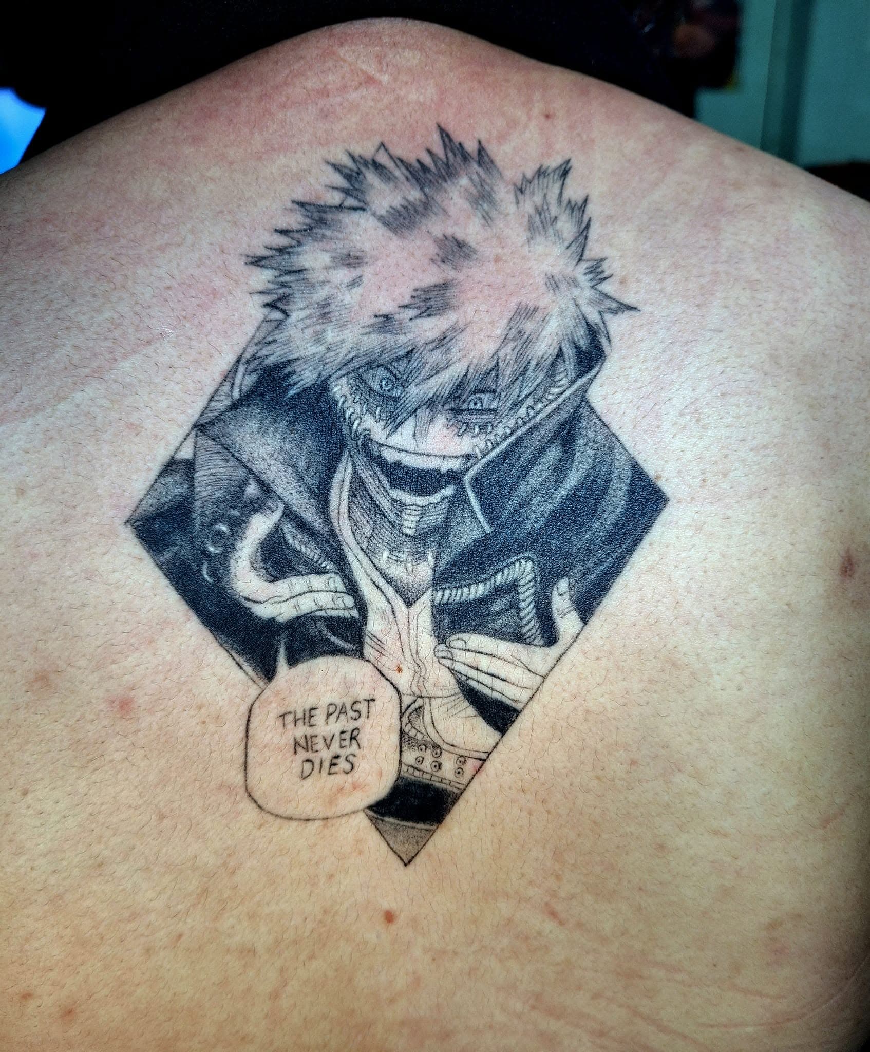 Healed anime-style tattoo
