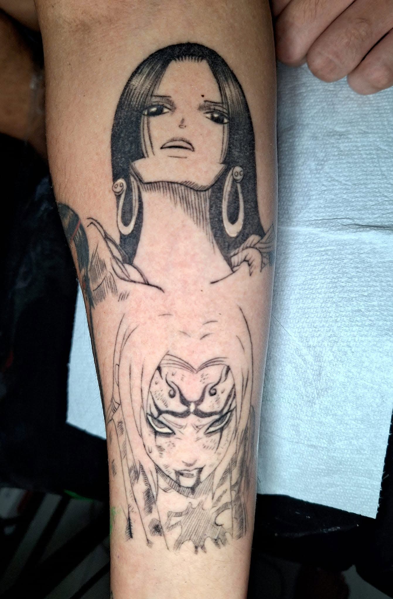 Healed manga-inspired tattoo