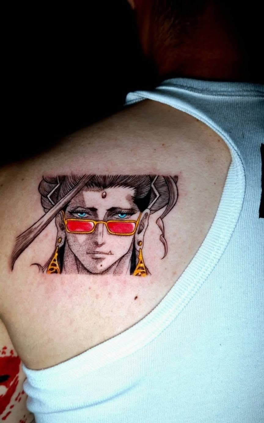Blackwork portrait tattoo of a figure in a moment of resolve