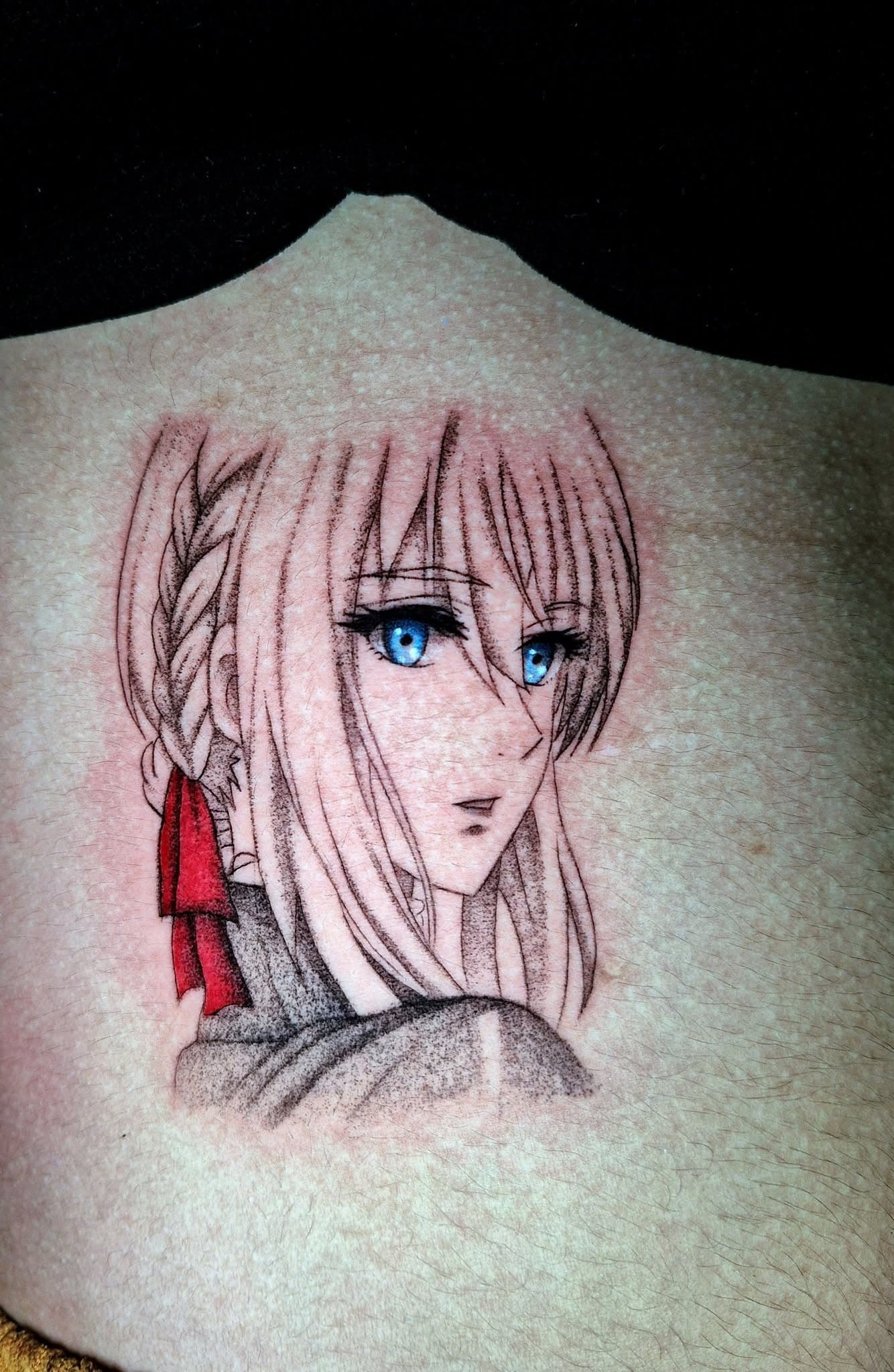 Fine-line anime tattoo of a female figure